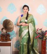 green woven banarasi silk blend saree with blouse