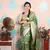 green woven banarasi silk blend saree with blouse