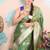 green woven banarasi silk blend saree with blouse