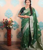 green woven banarasi silk blend saree with blouse