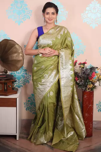 green woven banarasi silk blend saree with blouse