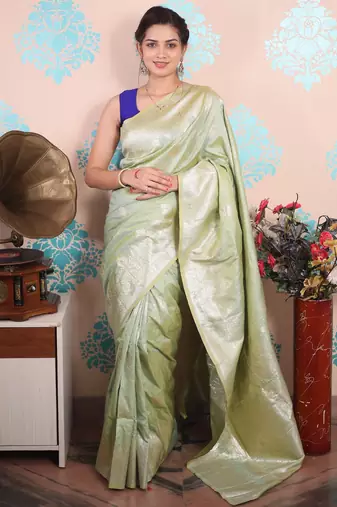 light green woven banarasi silk blend saree with blouse