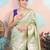 light green woven banarasi silk blend saree with blouse
