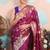 wine woven banarasi silk blend saree with blouse