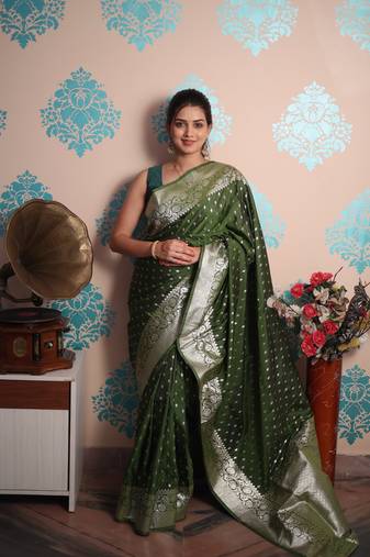 green woven banarasi silk blend saree with blouse