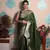 green woven banarasi silk blend saree with blouse