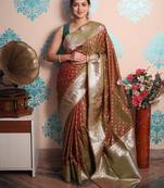 rust woven banarasi silk blend saree with blouse