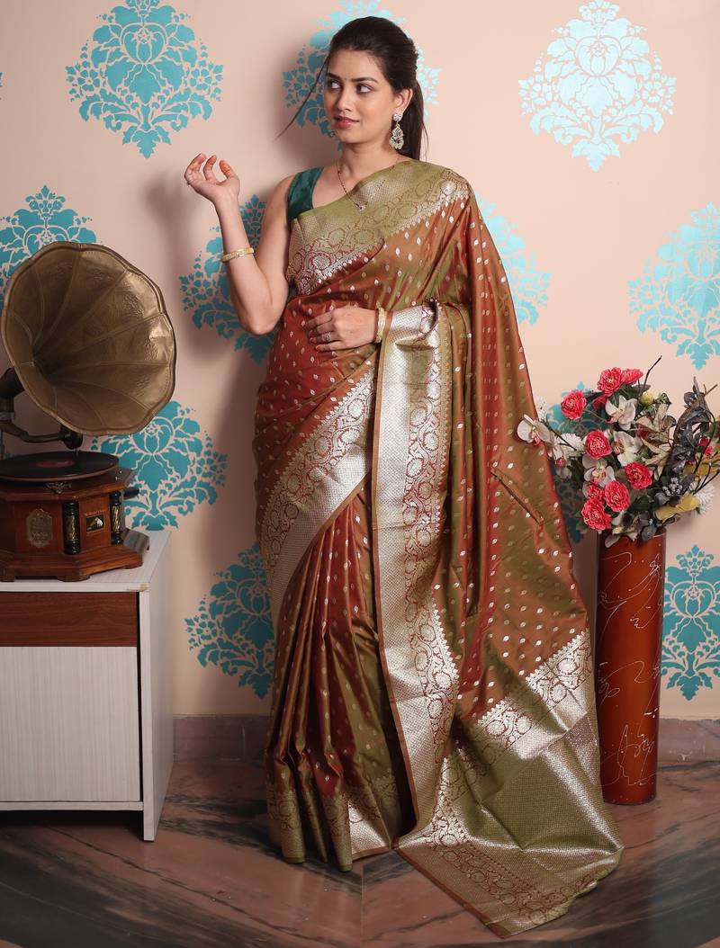 rust woven banarasi silk blend saree with blouse