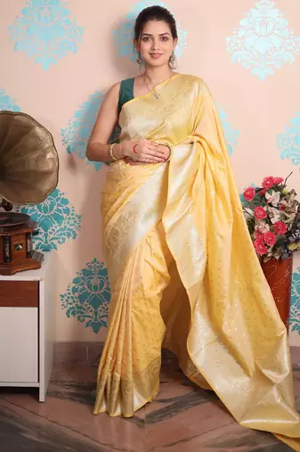 yellow woven banarasi silk blend saree with blouse