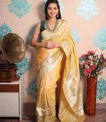 yellow woven banarasi silk blend saree with blouse