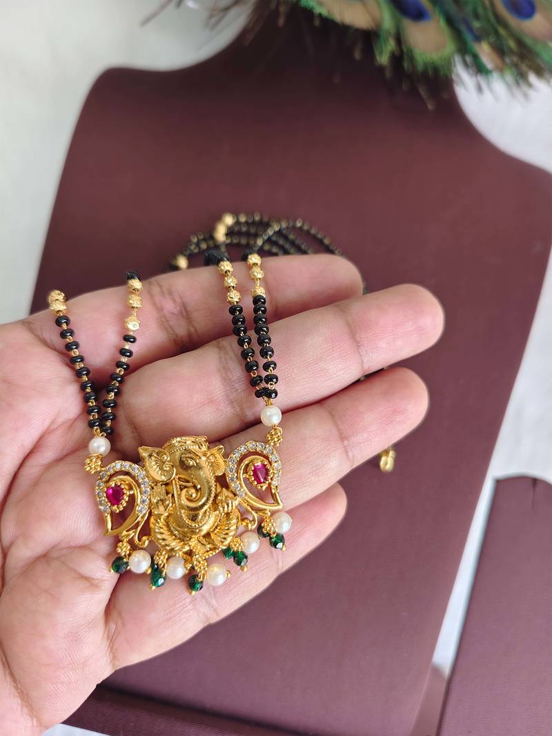 Gold plated temple ganesha black beads necklace