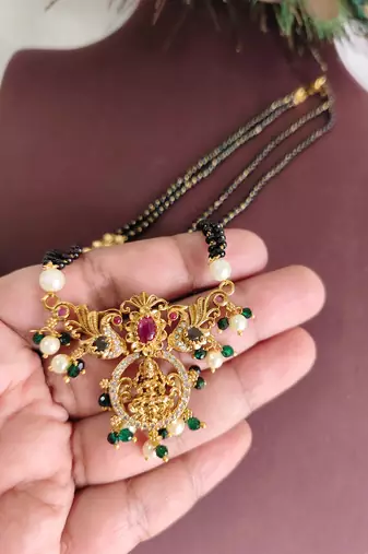 Gold plated temple lakshmi peacock stone black beads necklace