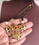 Gold plated temple lakshmi peacock stone black beads necklace