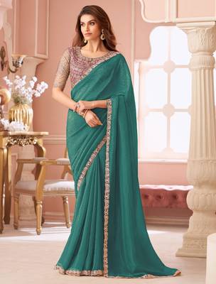 Teal green georgette saree with heavy embroidered blouse and lace border  for weddings, festive & special occasions 1
