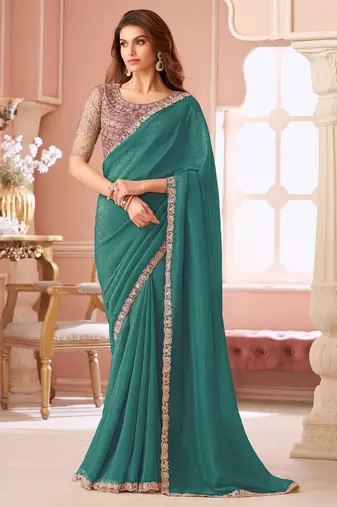 Teal green georgette saree with heavy embroidered blouse and lace border  for weddings, festive & special occasions