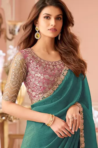 Teal green georgette saree with heavy embroidered blouse and lace border  for weddings, festive & special occasions