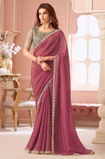 Dark pink georgette saree with heavy embroidered blouse and designer lace border  for weddings & special occasions