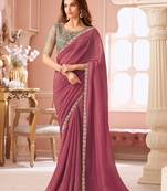 Dark pink georgette saree with heavy embroidered blouse and designer lace border  for weddings & special occasions