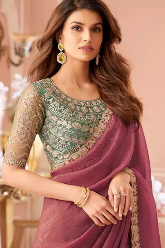 Dark pink georgette saree with heavy embroidered blouse and designer lace border  for weddings & special occasions