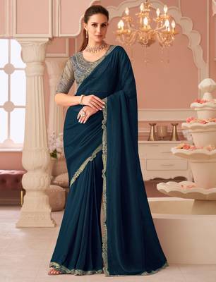 Teal georgette saree with heavy embroidered blouse and designer lace border  for weddings & special occasions 1
