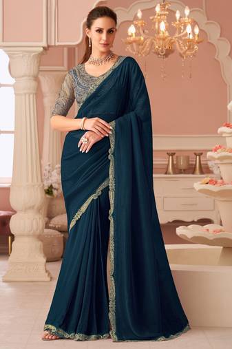 Teal georgette saree with heavy embroidered blouse and designer lace border  for weddings & special occasions