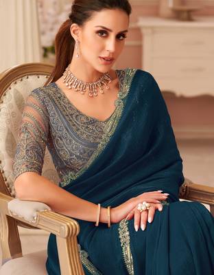 Teal georgette saree with heavy embroidered blouse and designer lace border  for weddings & special occasions 2