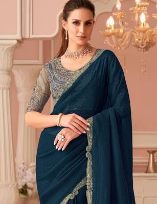 Teal georgette saree with heavy embroidered blouse and designer lace border  for weddings & special occasions 3