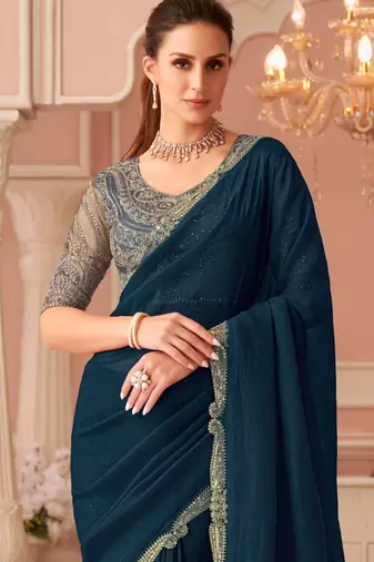 Teal georgette saree with heavy embroidered blouse and designer lace border  for weddings & special occasions