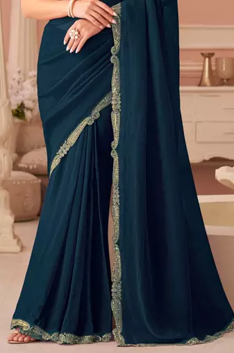 Teal georgette saree with heavy embroidered blouse and designer lace border  for weddings & special occasions