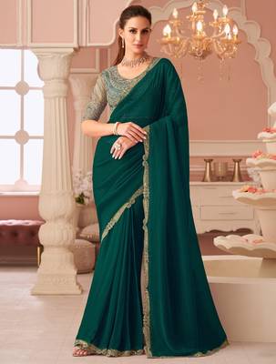 Green georgette saree with heavy embroidered blouse and designer lace border  for weddings, festive celebrations 1