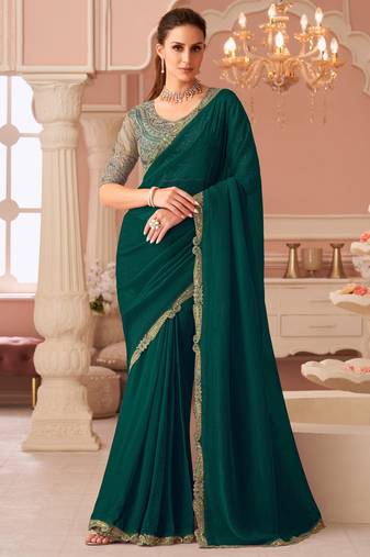 Green georgette saree with heavy embroidered blouse and designer lace border  for weddings, festive celebrations