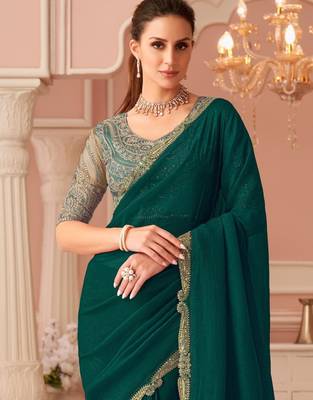 Green georgette saree with heavy embroidered blouse and designer lace border  for weddings, festive celebrations 3
