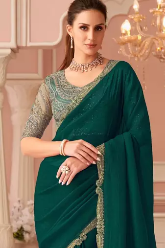 Green georgette saree with heavy embroidered blouse and designer lace border  for weddings, festive celebrations