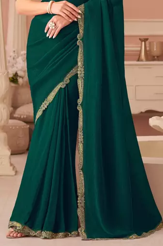 Green georgette saree with heavy embroidered blouse and designer lace border  for weddings, festive celebrations