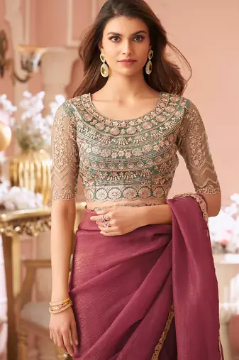 Dark pink georgette saree with heavy embroidered blouse and designer lace border  for weddings & special occasions