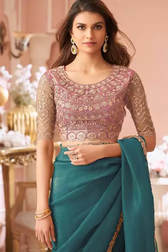 Teal green georgette saree with heavy embroidered blouse and lace border  for weddings, festive & special occasions