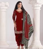 Red roman silk semi stitched suit with embroidery & real mirror work