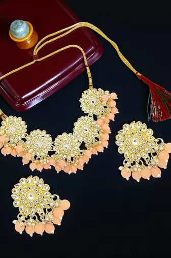 Gold plated peach kundan necklace set