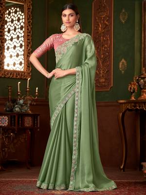 Green satin saree, lace border with heavy embroidered blouse for special occasions 1