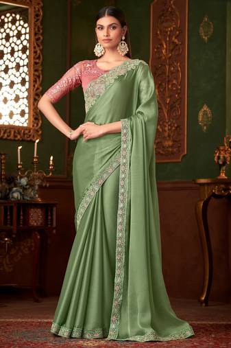 Green satin saree, lace border with heavy embroidered blouse for special occasions