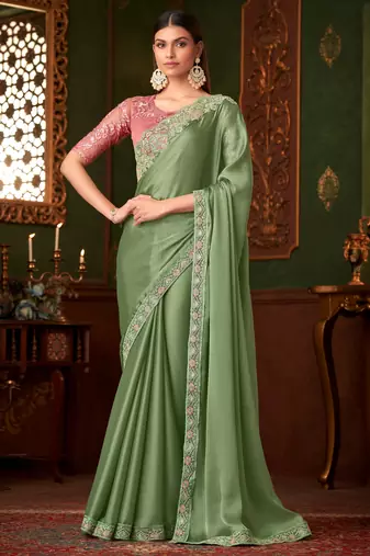 Green satin saree, lace border with heavy embroidered blouse for special occasions