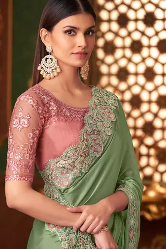 Green satin saree, lace border with heavy embroidered blouse for special occasions