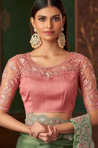 Green satin saree, lace border with heavy embroidered blouse for special occasions