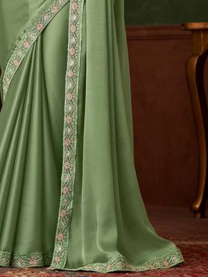 Green satin saree, lace border with heavy embroidered blouse for special occasions 4