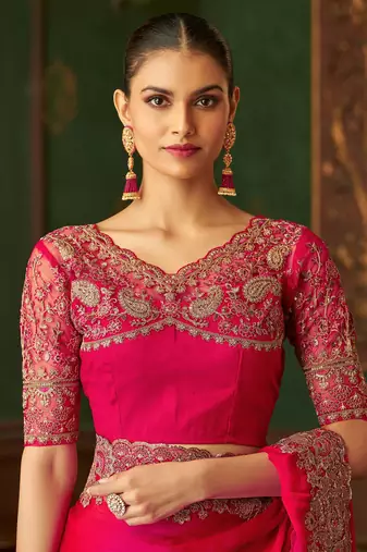 Rani pink satin silk saree, lace border with heavy embroidered blouse for special occasions