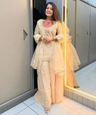 Cream roman shimmer readymade kurti set with hand & moti  1