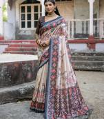 black tussar art silk patola print saree with floral jal design and contrast blouse piece