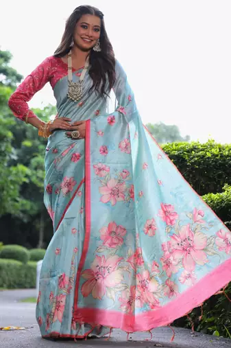 Sky blue tussar silk printed saree with floral pallu, traditional border, fancy tassels & contrast blouse
