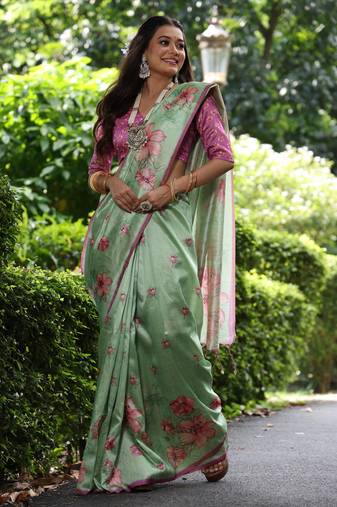 Pista green tussar silk printed saree with floral pallu, traditional border, fancy tassels & contrast blouse