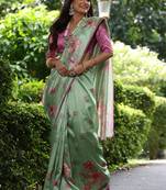 Pista green tussar silk printed saree with floral pallu, traditional border, fancy tassels & contrast blouse